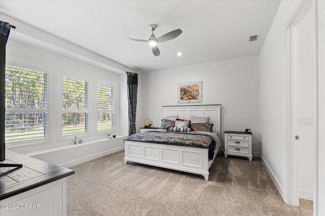 carpeted bedroom with ceiling fan