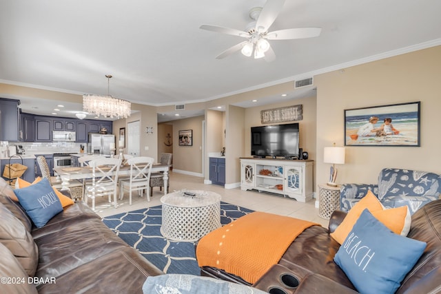 living room with ceiling fan with notable chandelier, ornamental molding, and light tile patterned floors