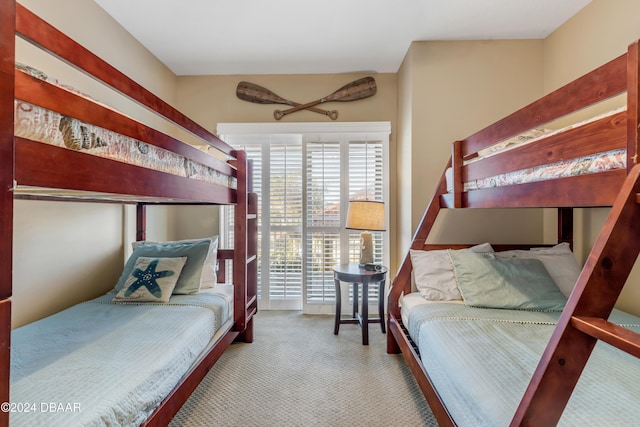 bedroom featuring light colored carpet