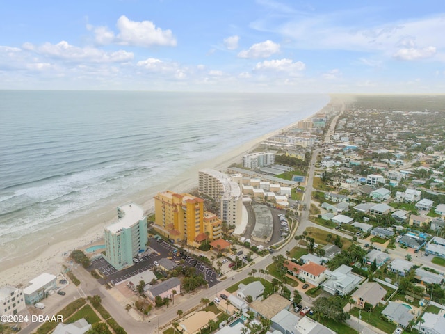 drone / aerial view featuring a view of the beach and a water view