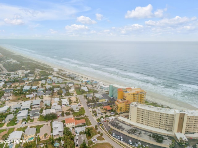 aerial view featuring a view of the beach and a water view