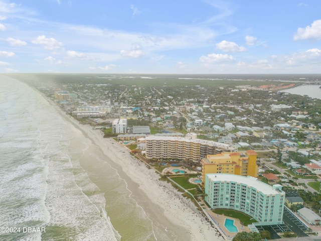 bird's eye view featuring a water view and a view of the beach