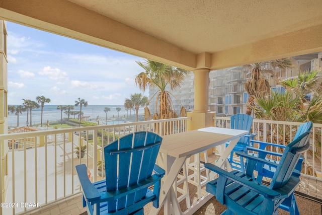 balcony featuring a water view