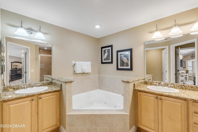 bathroom featuring vanity and plus walk in shower