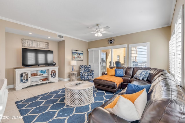 tiled living room featuring ceiling fan and ornamental molding