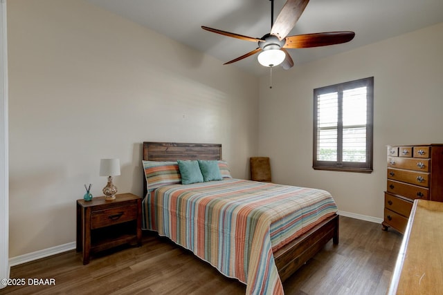 bedroom with dark wood-type flooring and ceiling fan