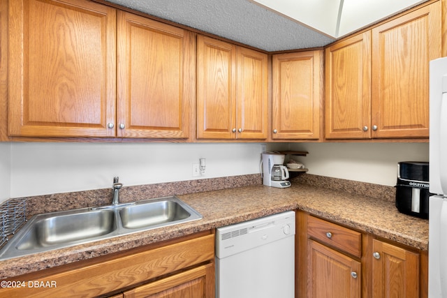 kitchen featuring dishwasher and sink