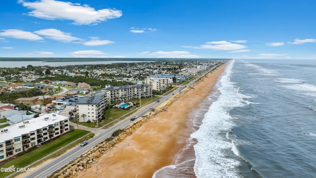 birds eye view of property featuring a view of the beach and a water view