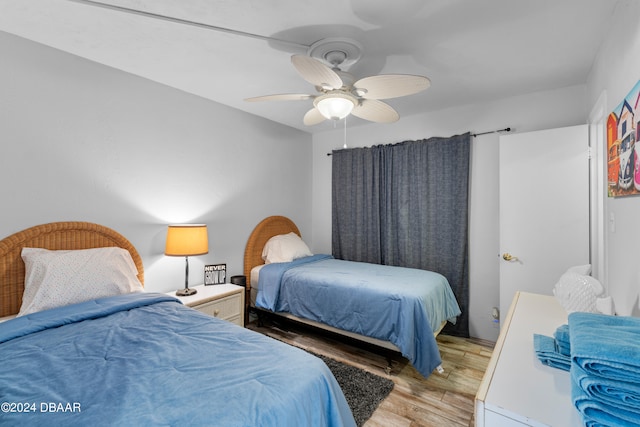 bedroom featuring light hardwood / wood-style flooring and ceiling fan