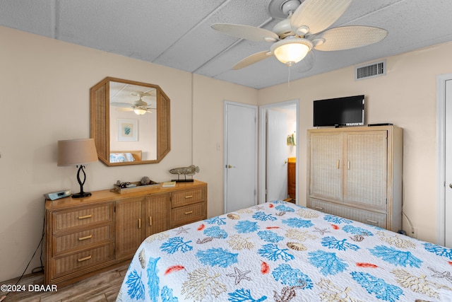 bedroom featuring light wood-type flooring and ceiling fan