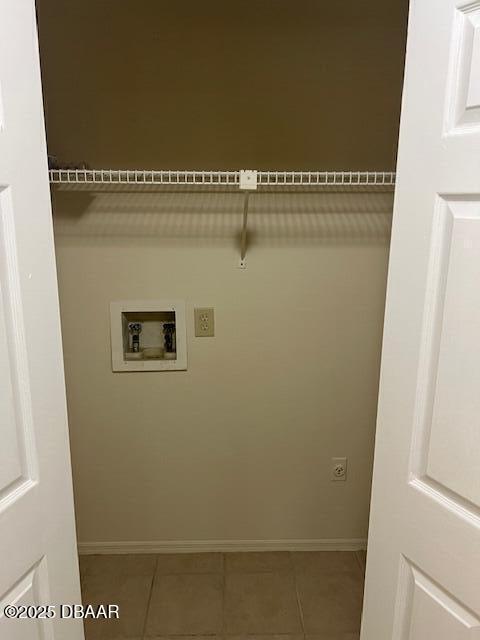 washroom with washer hookup and tile patterned floors