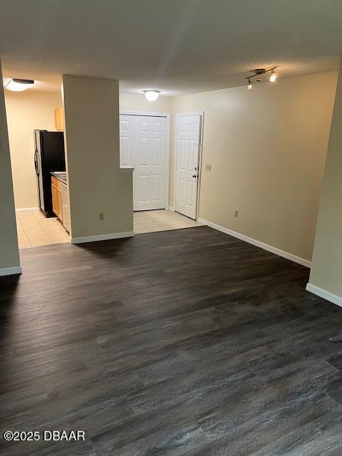 unfurnished room featuring dark hardwood / wood-style floors