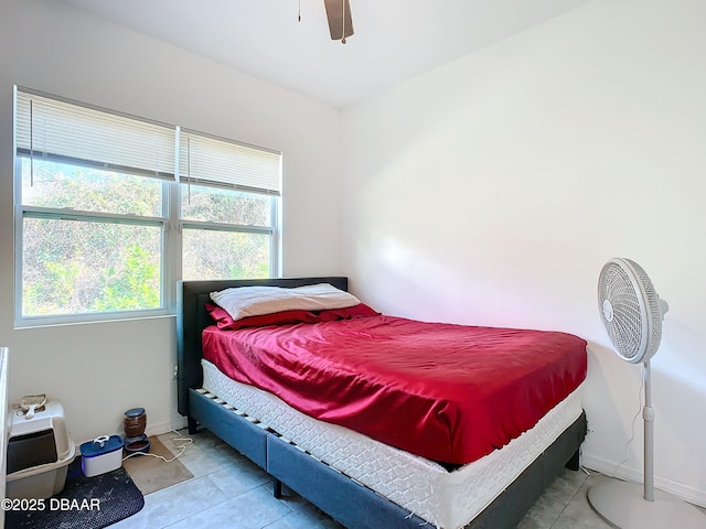 bedroom with light tile patterned flooring and ceiling fan