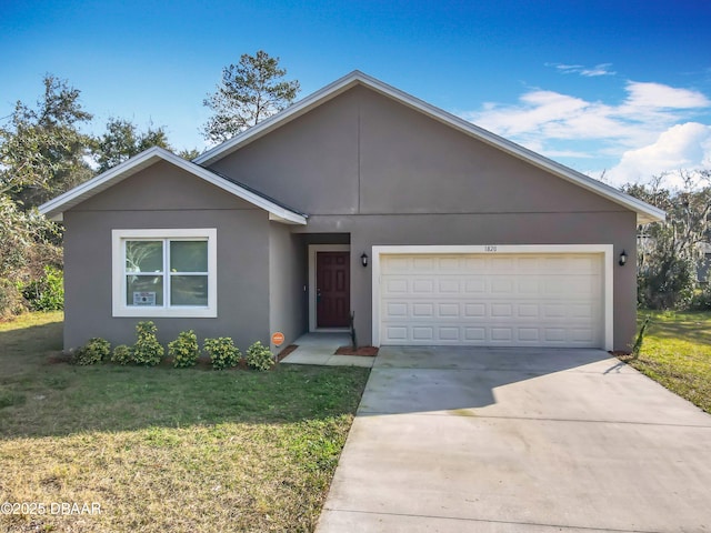 view of front of house featuring a garage and a front yard