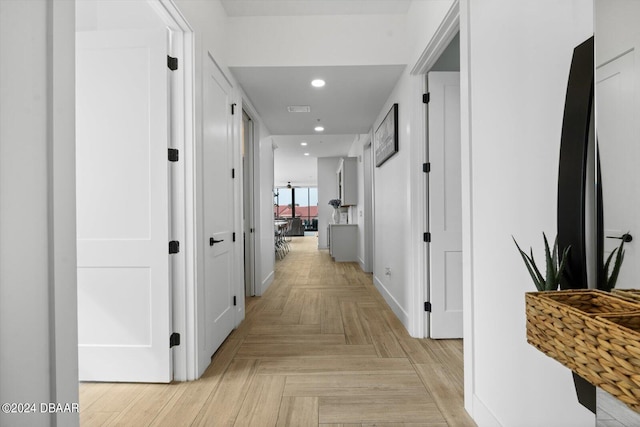 hall featuring light parquet flooring