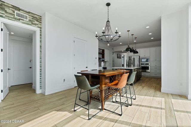 dining space featuring an inviting chandelier