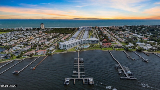 aerial view at dusk with a water view