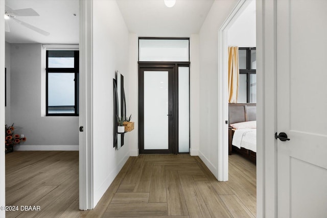 hall featuring light parquet flooring