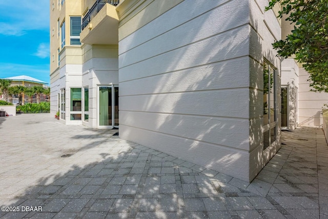 view of property exterior featuring a patio area