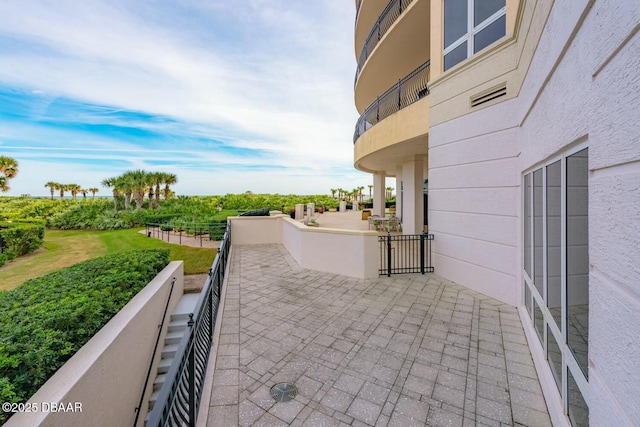 view of patio featuring a balcony