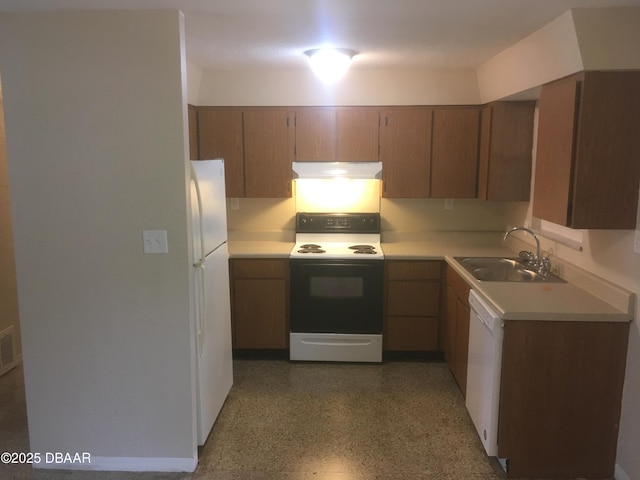 kitchen with sink and white appliances