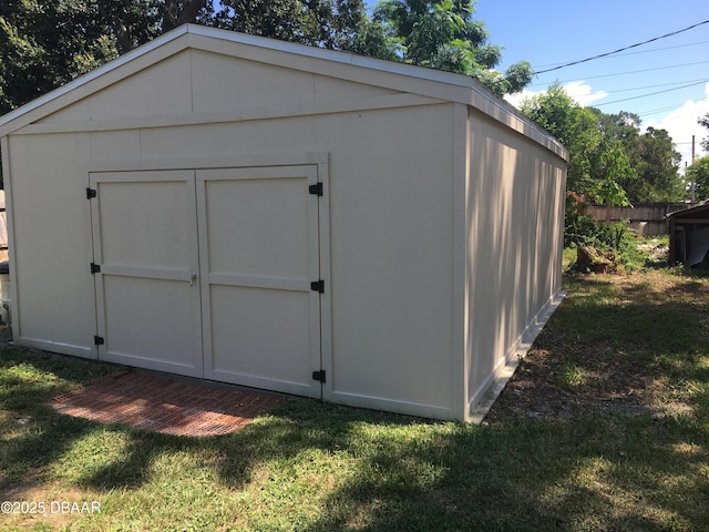 view of outdoor structure with a yard