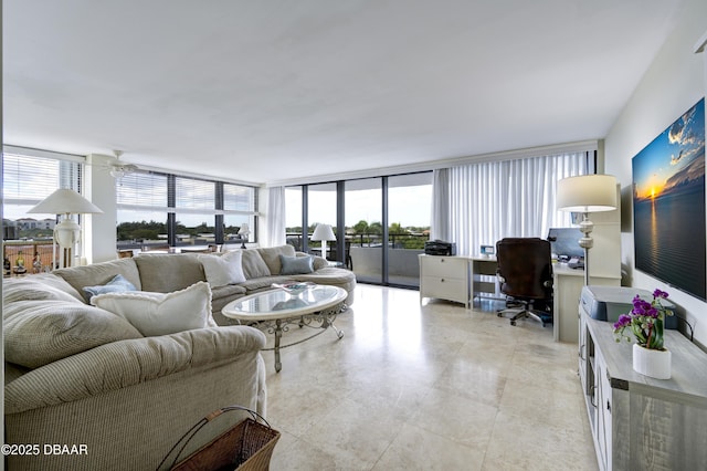 living room with floor to ceiling windows and ceiling fan