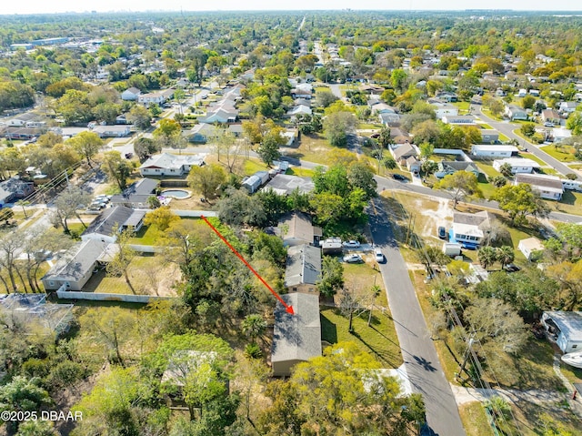 birds eye view of property with a residential view