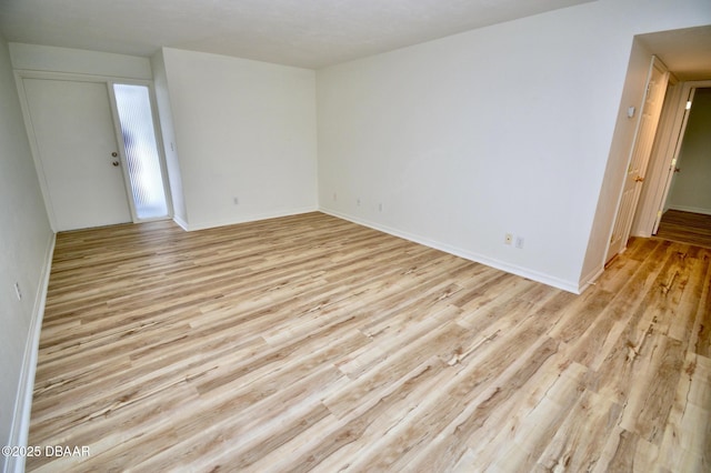 spare room featuring light hardwood / wood-style flooring