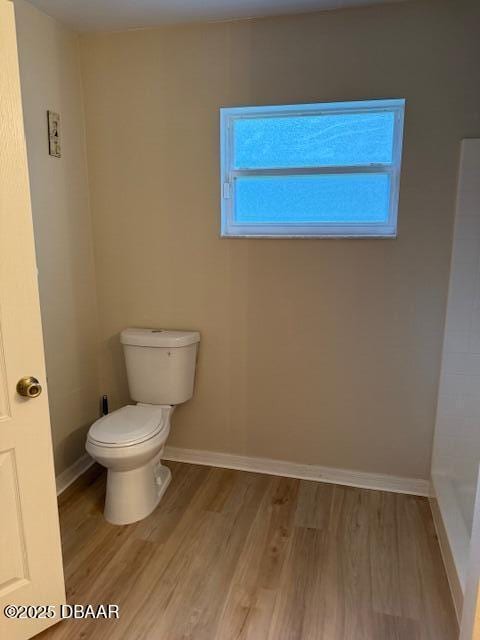 107 Beacon Mill Ln, Palm Coast, FL 32137 - bathroom with toilet and wood finished floors