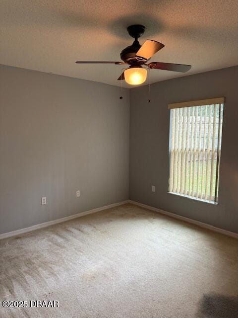 107 Beacon Mill Ln, Palm Coast, FL 32137 - empty room featuring carpet, a ceiling fan, and a textured ceiling