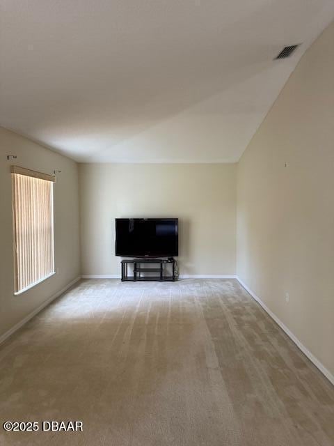 107 Beacon Mill Ln, Palm Coast, FL 32137 - unfurnished living room with baseboards and carpet floors