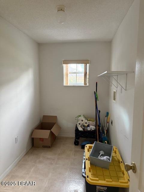 107 Beacon Mill Ln, Palm Coast, FL 32137 - laundry area featuring washer hookup and a textured ceiling