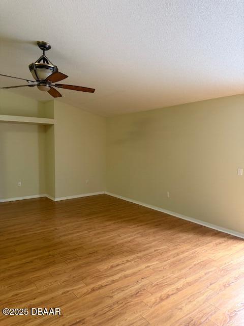 107 Beacon Mill Ln, Palm Coast, FL 32137 - spare room with a ceiling fan, light wood-type flooring, and a textured ceiling