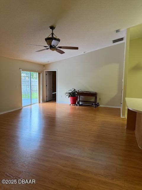 107 Beacon Mill Ln, Palm Coast, FL 32137 - empty room featuring wood finished floors and a ceiling fan
