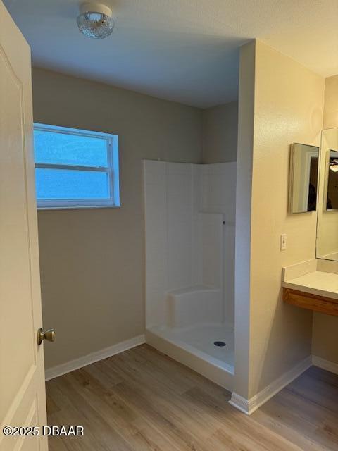 107 Beacon Mill Ln, Palm Coast, FL 32137 - full bathroom featuring wood finished floors and a walk in shower