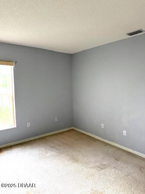107 Beacon Mill Ln, Palm Coast, FL 32137 - carpeted empty room with baseboards and a textured ceiling