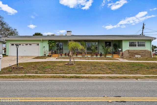 ranch-style home featuring covered porch, concrete driveway, and a garage