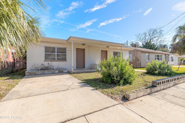 ranch-style home with fence