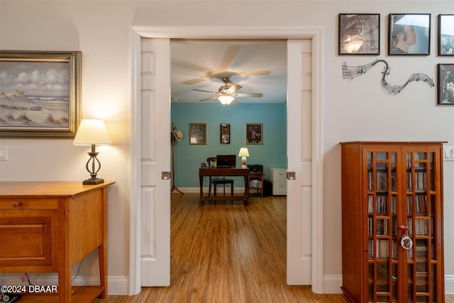 corridor featuring light hardwood / wood-style floors