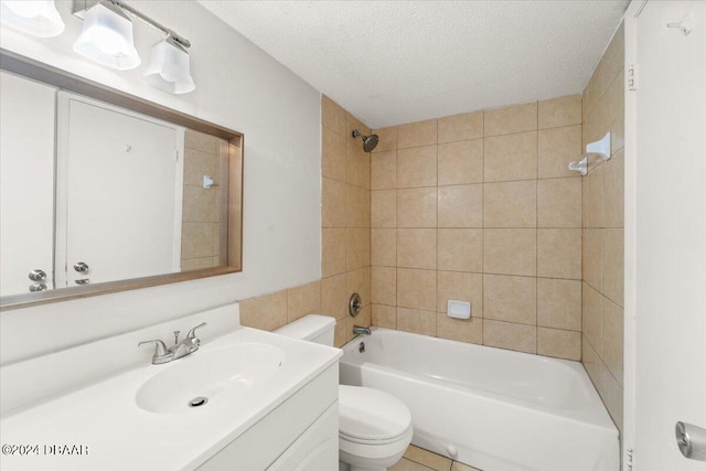 full bathroom featuring vanity, a textured ceiling, toilet, and tiled shower / bath combo