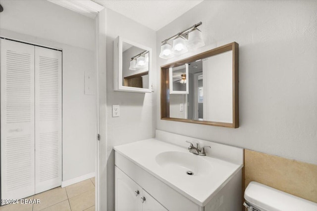 305 Ridge Blvd Unit 2130, Daytona Beach, FL 32119 - bathroom featuring a closet, vanity, toilet, and tile patterned flooring