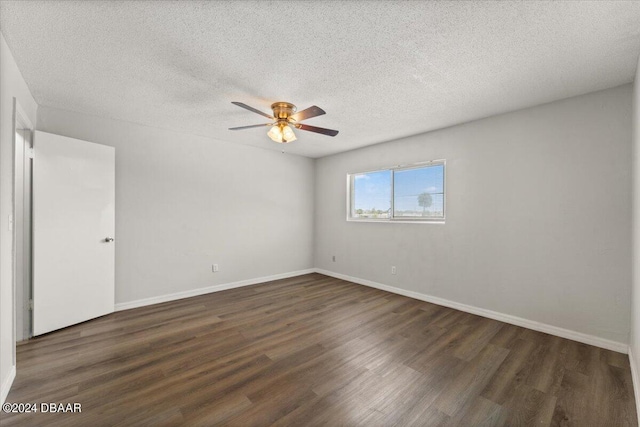 empty room featuring ceiling fan, baseboards, a textured ceiling, and wood finished floors