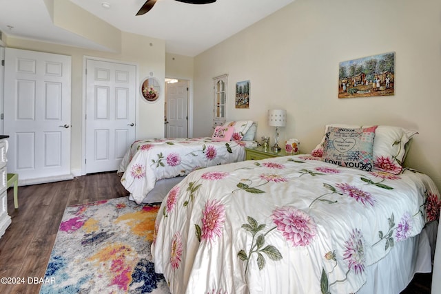 bedroom with ceiling fan and dark hardwood / wood-style floors