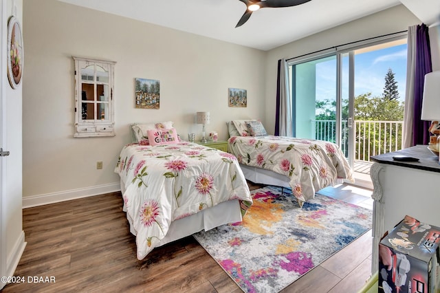 bedroom featuring ceiling fan, dark hardwood / wood-style floors, and access to exterior