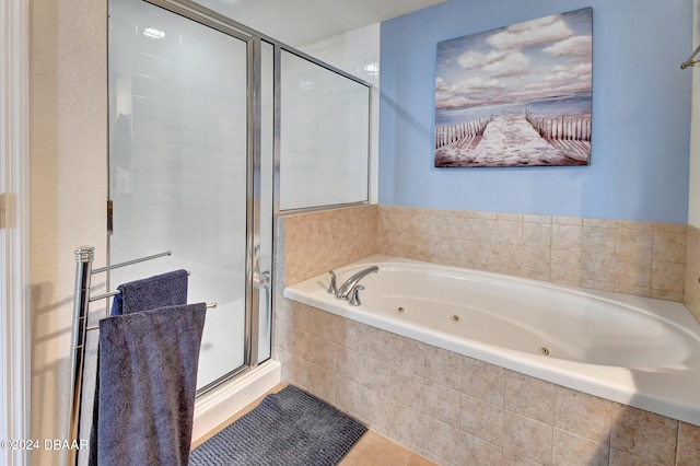 bathroom featuring tile patterned flooring and plus walk in shower