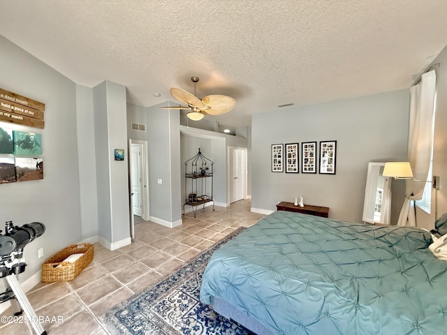 1811 N Central Ave, Flagler Beach, FL 32136 - bedroom featuring visible vents, a textured ceiling, ceiling fan, and tile patterned floors