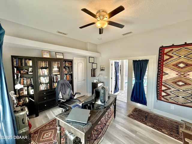 1811 N Central Ave, Flagler Beach, FL 32136 - office space with ceiling fan, visible vents, and light wood-style flooring