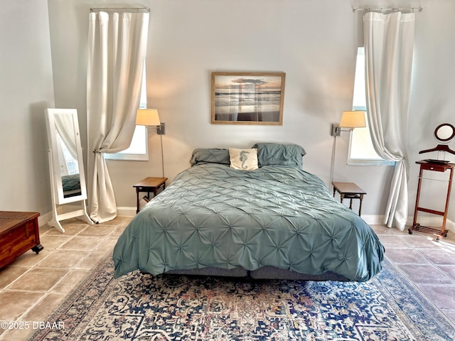 1811 N Central Ave, Flagler Beach, FL 32136 - tiled bedroom featuring baseboards