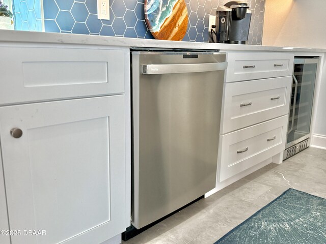 1811 N Central Ave, Flagler Beach, FL 32136 - room details with wine cooler, decorative backsplash, white cabinets, and dishwasher